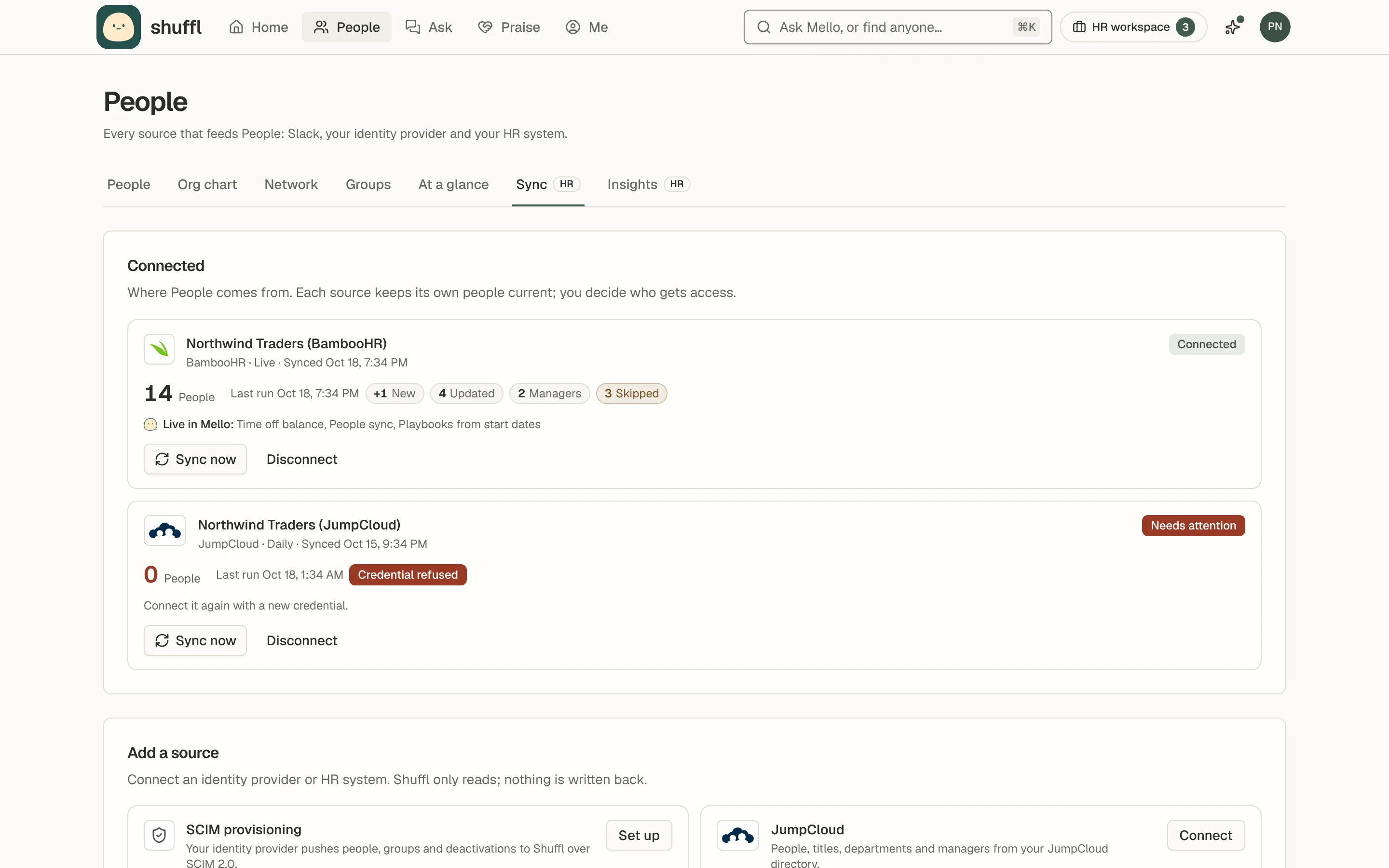 The Connected section of the Sync tab with two sources: BambooHR, live, with its people count and last run as chips such as +1 New, 4 Updated and 3 Skipped, and JumpCloud marked Needs attention with a Credential refused chip, each with Sync now and Disconnect buttons.